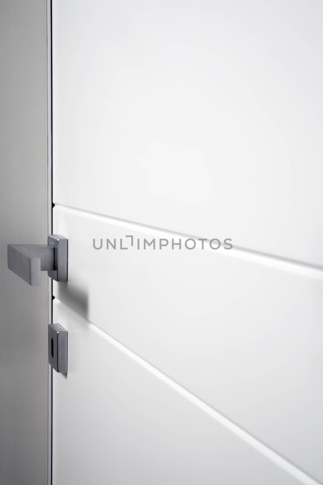 particular white closed door by diecidodici