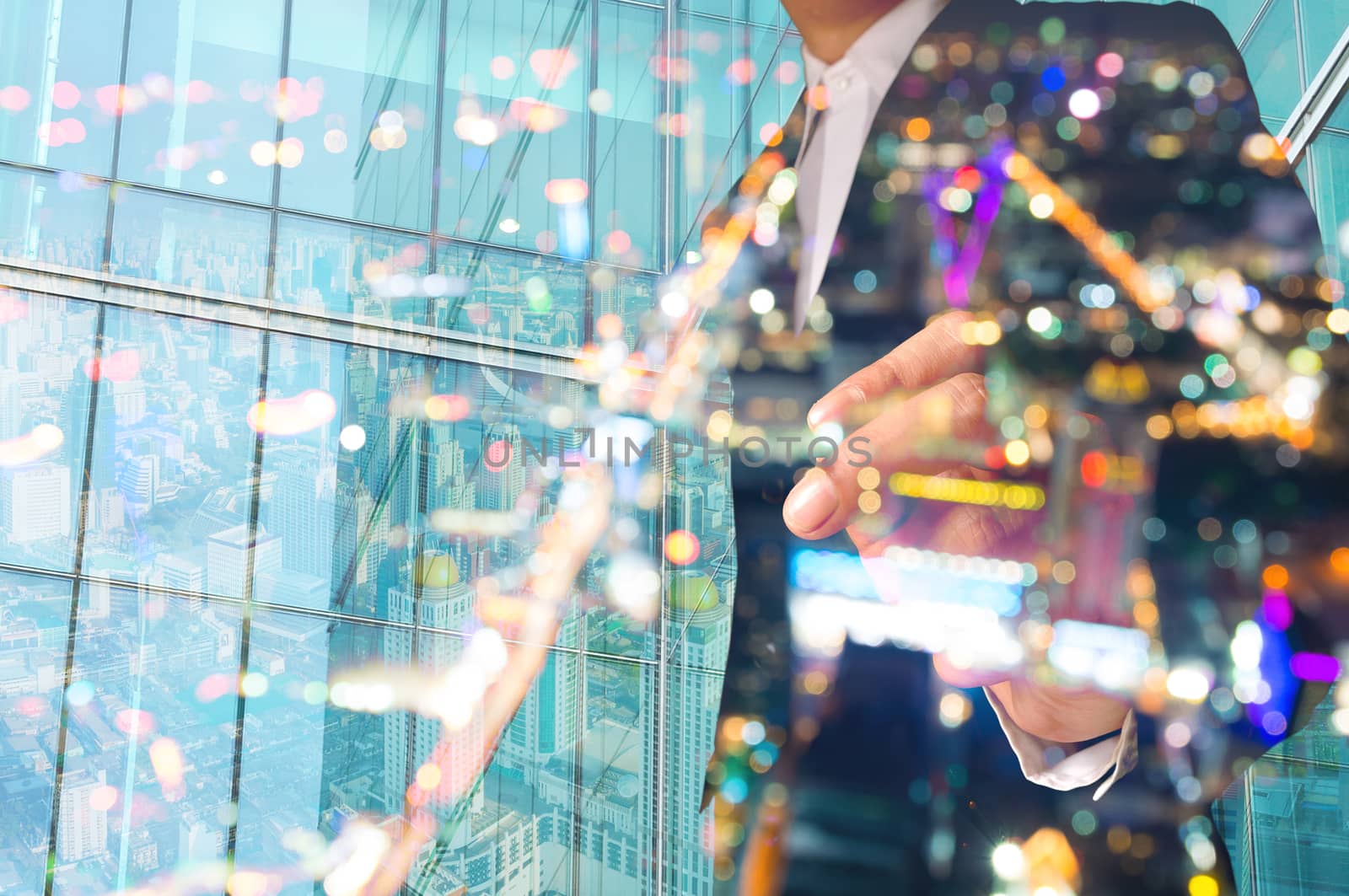 Double Exposure of Businessman draw Something with City Scene and Glass decorated Building