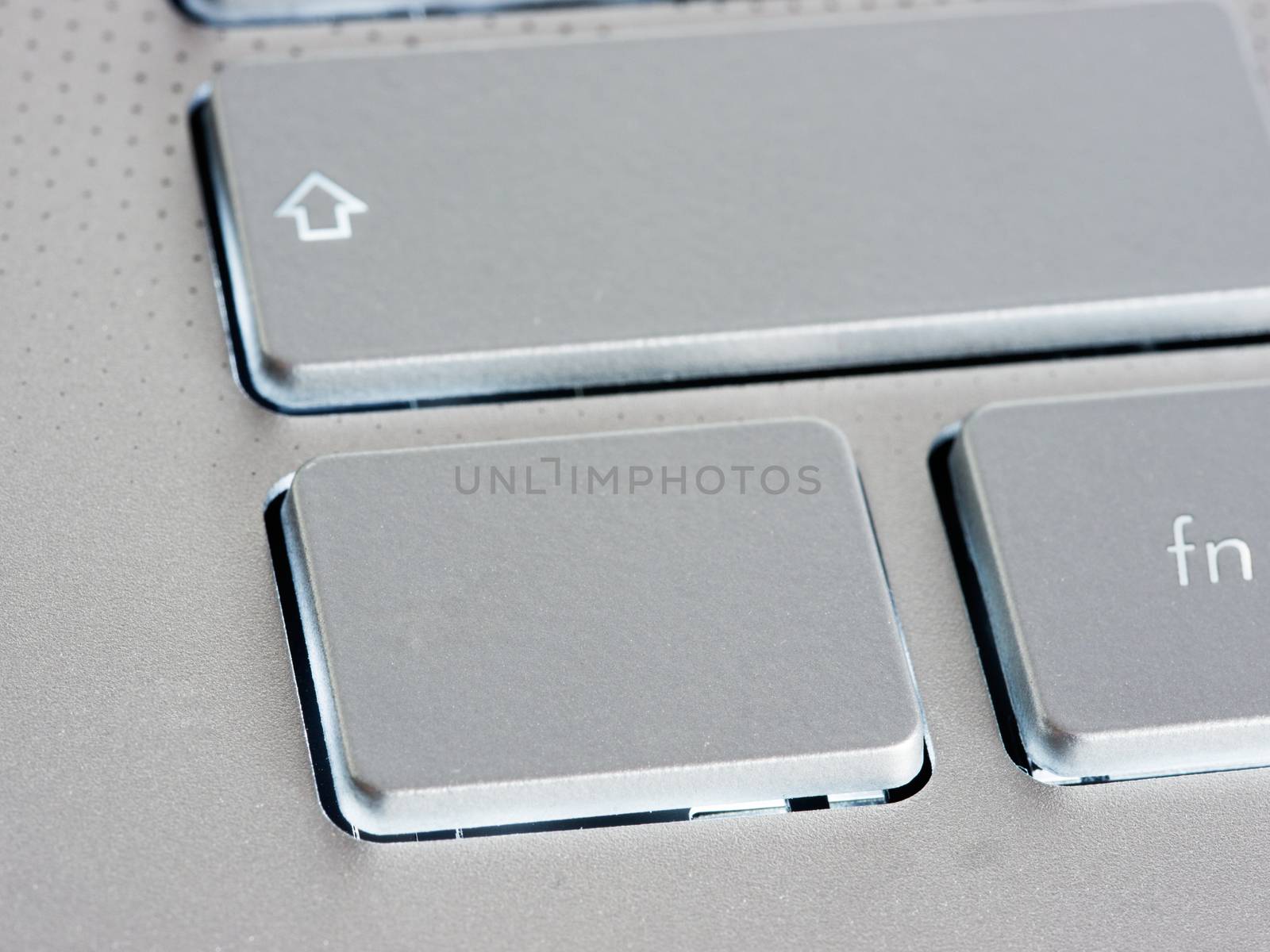 Blank silver button on laptop keyboard. Empty key button with copy space for message. Extreme close up