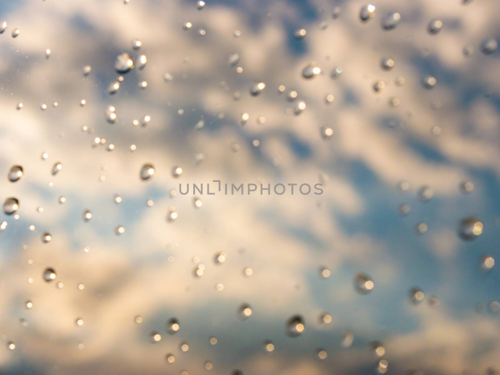drops of rain on window glass by fascinadora