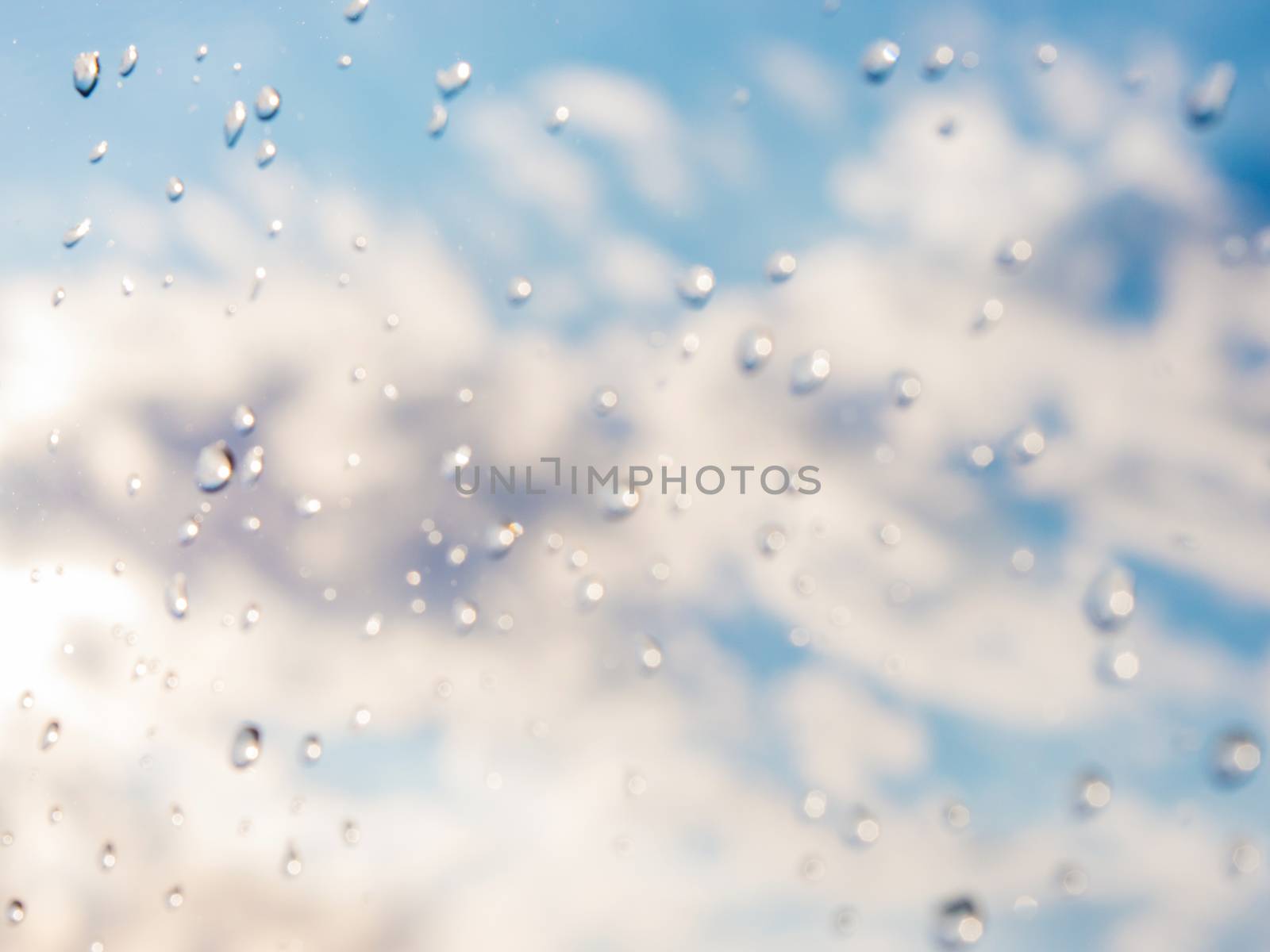 drops of rain on window glass by fascinadora