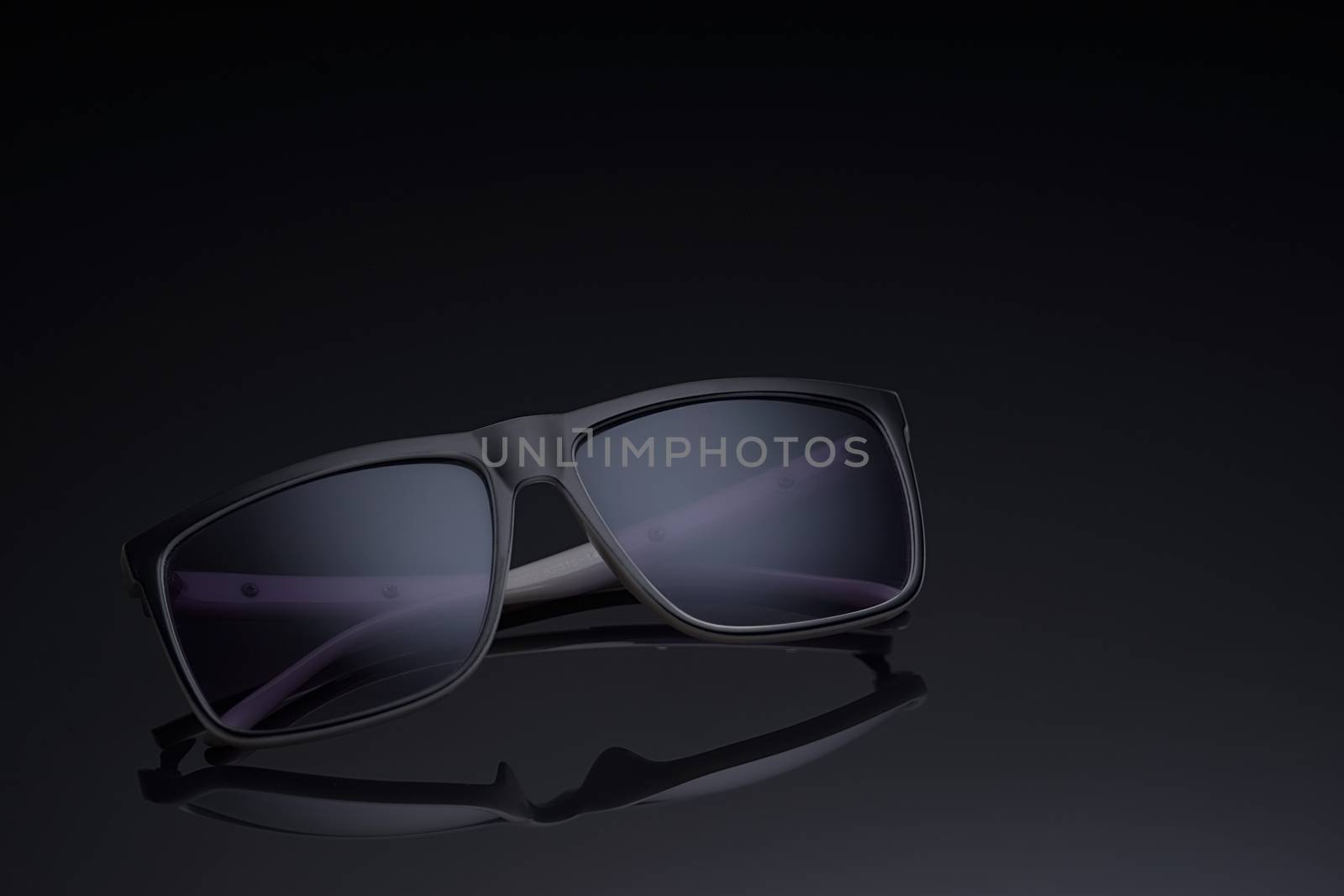 sunglasses polarized glasses on a dark background by vmytra