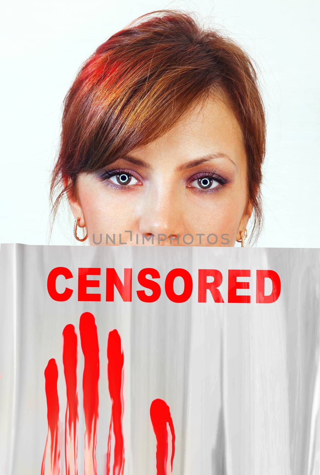 screen that covering part of woman face which represents censorship of statements