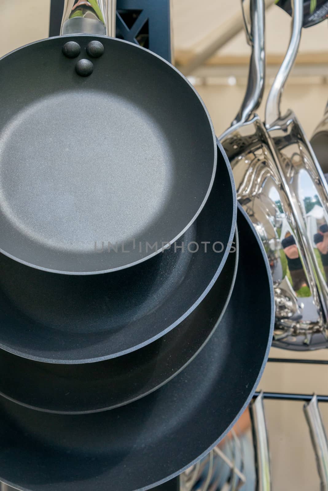 new modern pots and pans close-up by vlaru