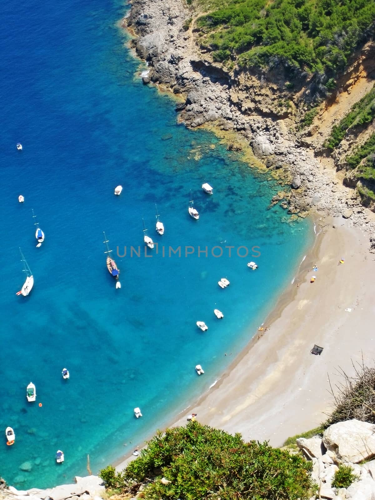 Coll Baix beach / playa, Majorca, Spain - bay with clear turquoise water - detail view from above during hiking tour