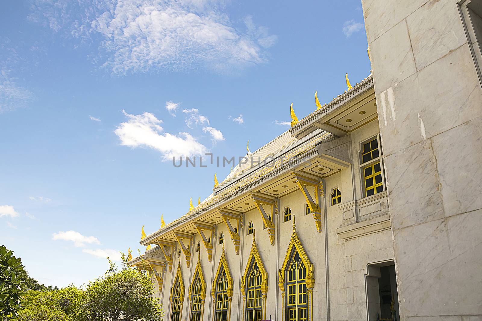Detail of wall and window temple' construction with clear sky background at Wat Sothorn, Chachoengsao Thailand.