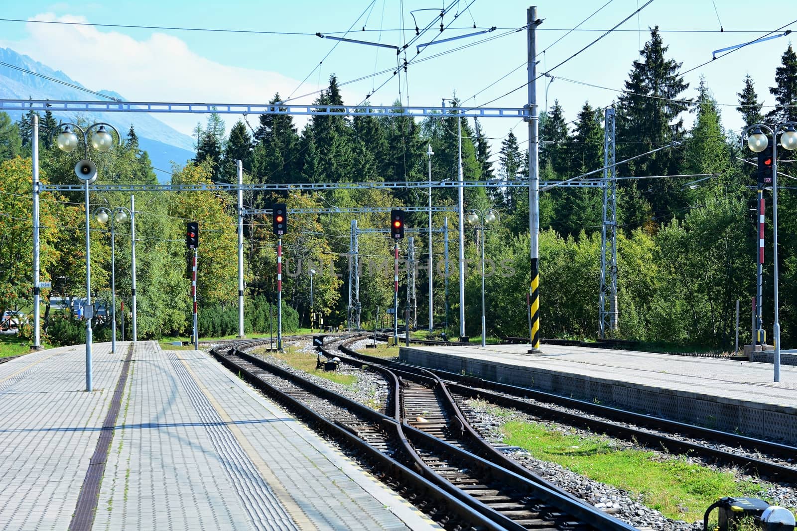 Empty platforms without trains and people at terminal railway station Strbske pleso in High Tatras, Slovakia.