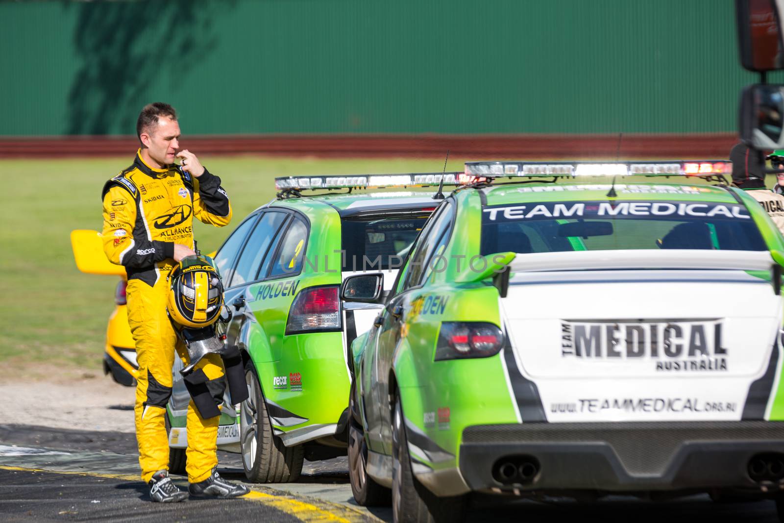 MELBOURNE/AUSTRALIA - SEPTEMBER 17, 2016: Moments after a 5 car smash, Andrew Jones waits for his car to be salvaged in the Dunlop Series Race  3 at the Wilson Security Sandown 500 'Retro' Endurance race at Sandown raceway.