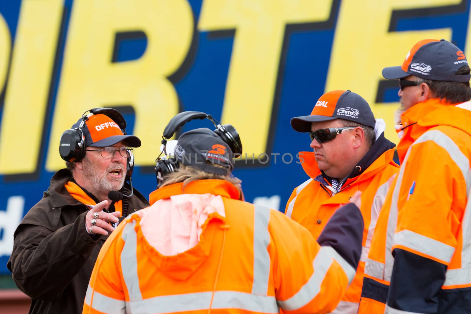 MELBOURNE/AUSTRALIA - SEPTEMBER 17, 2016: Race officials being briefed before the race at the Wilson Security Sandown 500 'Retro' Endurance race at Sandown raceway.