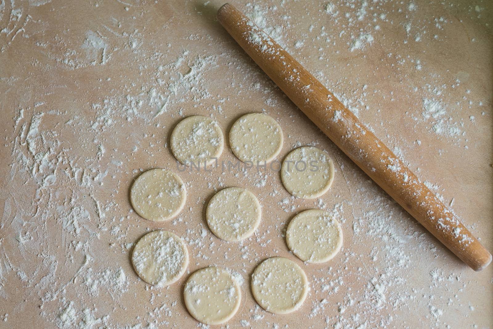 Dough circles and rolling pin by okskukuruza
