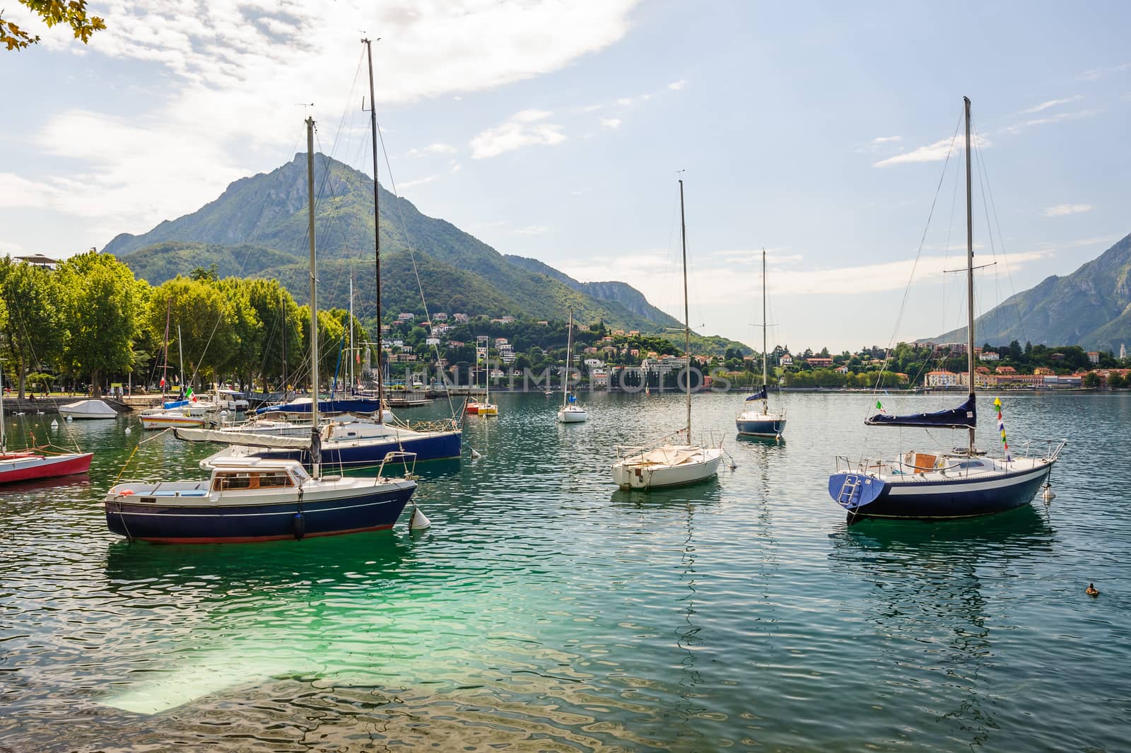 View of Lecco, Italy, with boats at foreground by starush