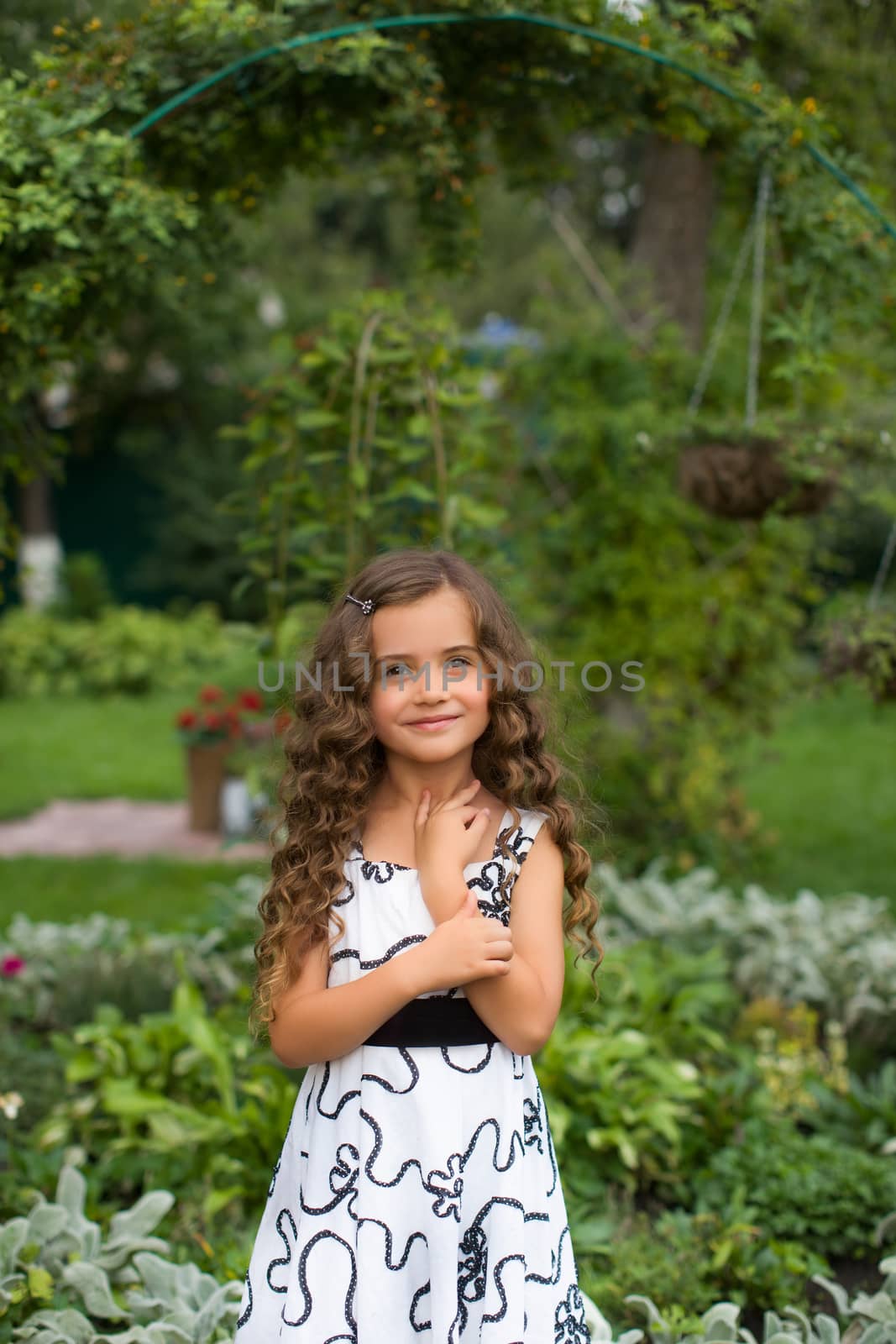 Girl with long hair on nature in a warm summer day