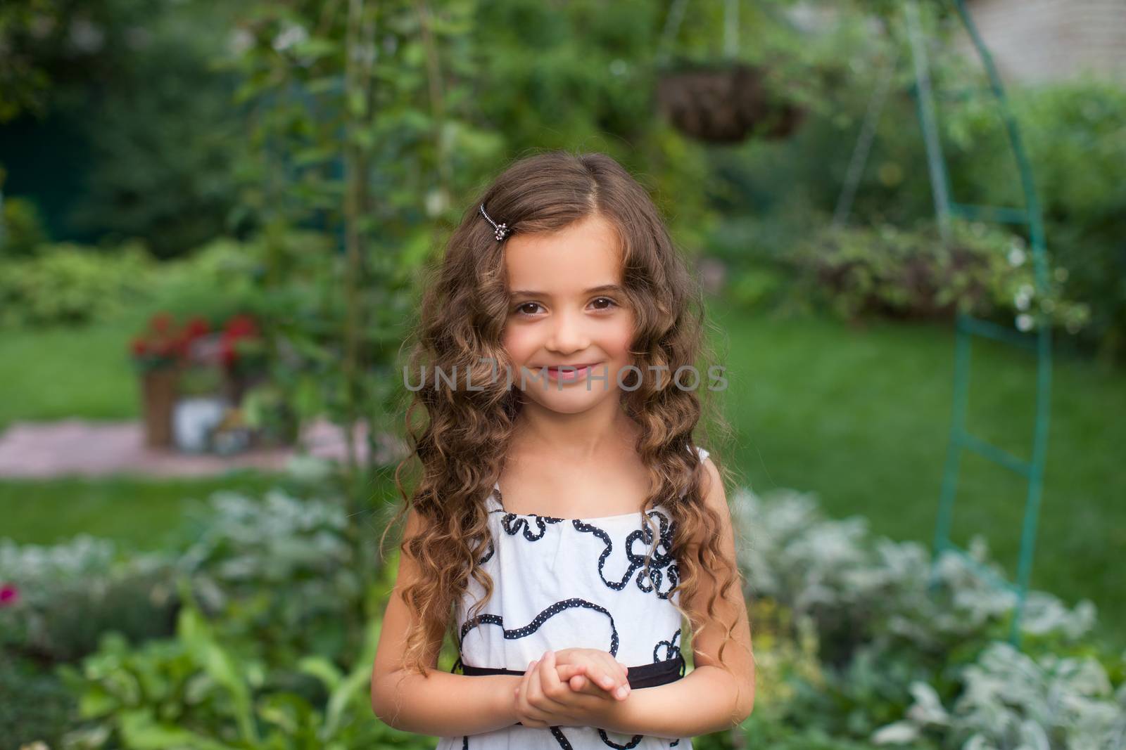 Girl with long hair on nature in a warm summer day