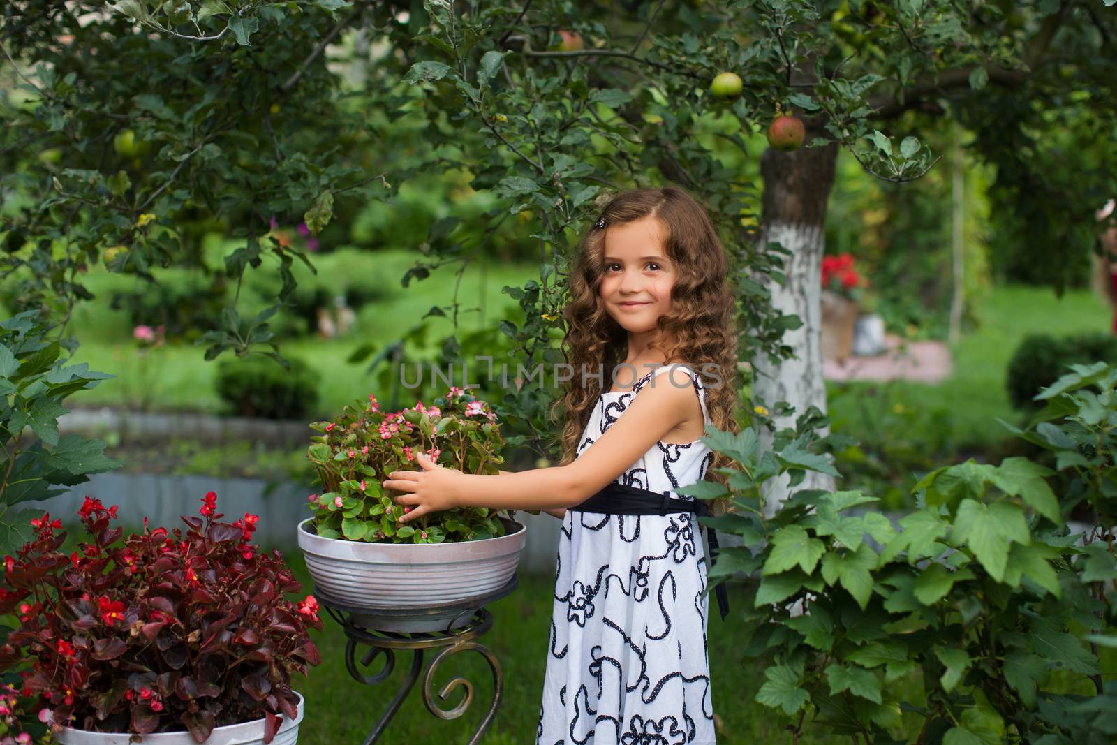 Girl with long hair on nature in a warm summer day