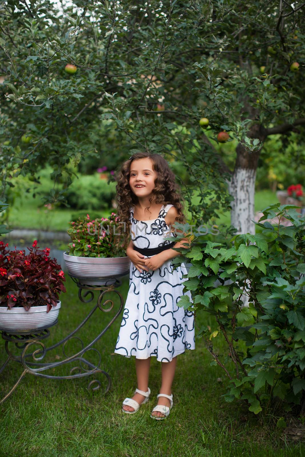 Girl with long hair on nature in a warm summer day