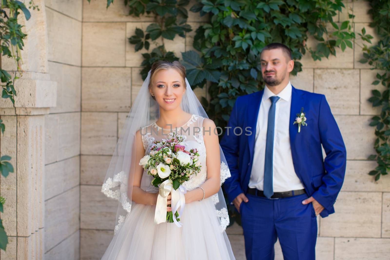 Newlyweds on a walk in a summer day wedding