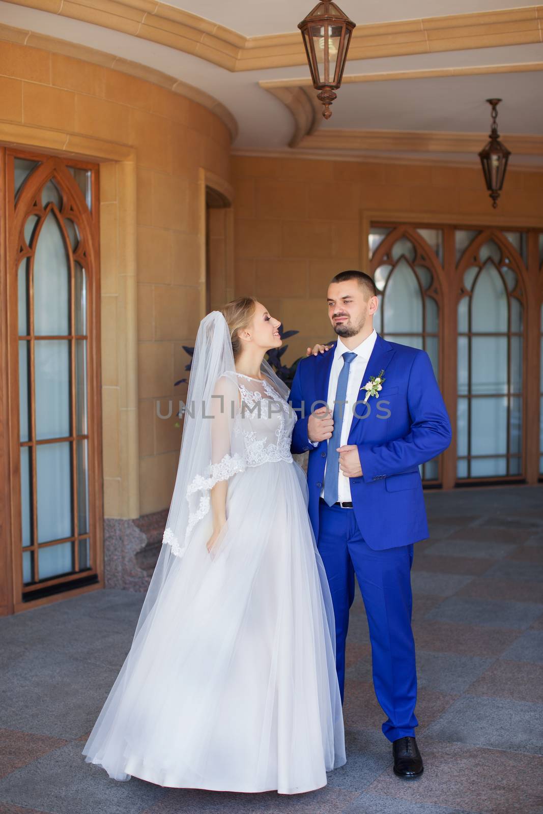 Newlyweds on a walk in a summer day wedding