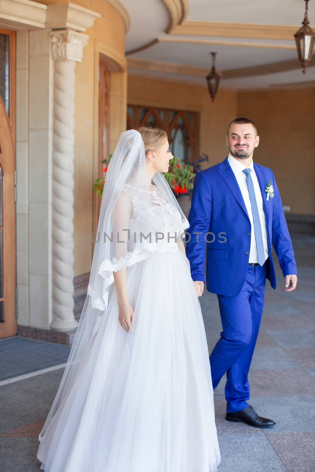 Newlyweds on a walk in a summer day wedding