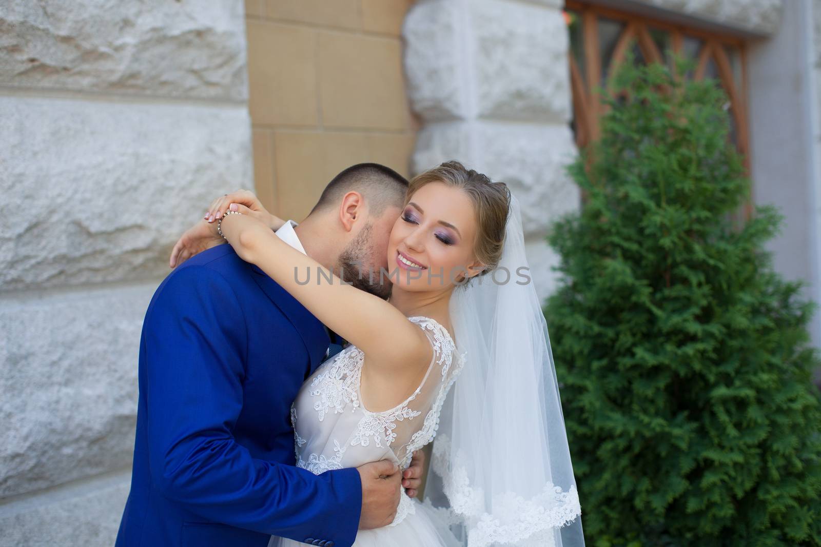 Newlyweds on a walk in a summer day wedding