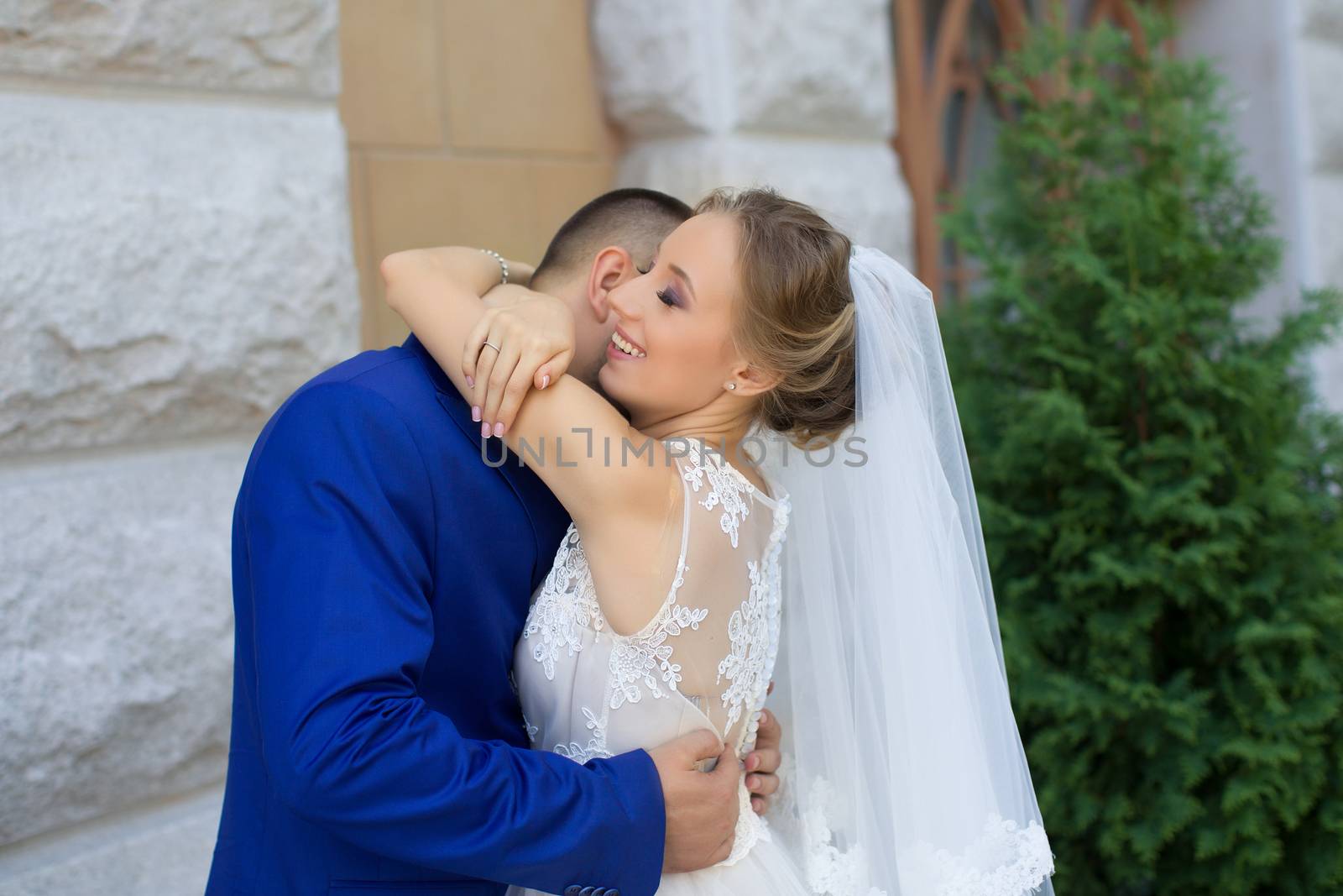 Newlyweds on a walk in a summer day wedding