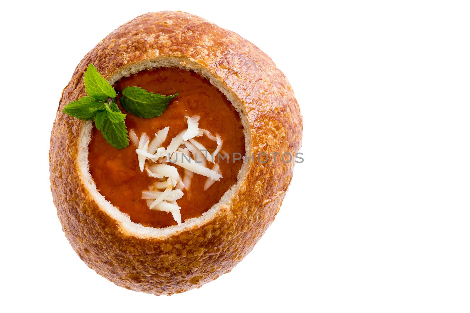 Isolated tomato soup in a sourdough bread bowl by coskun