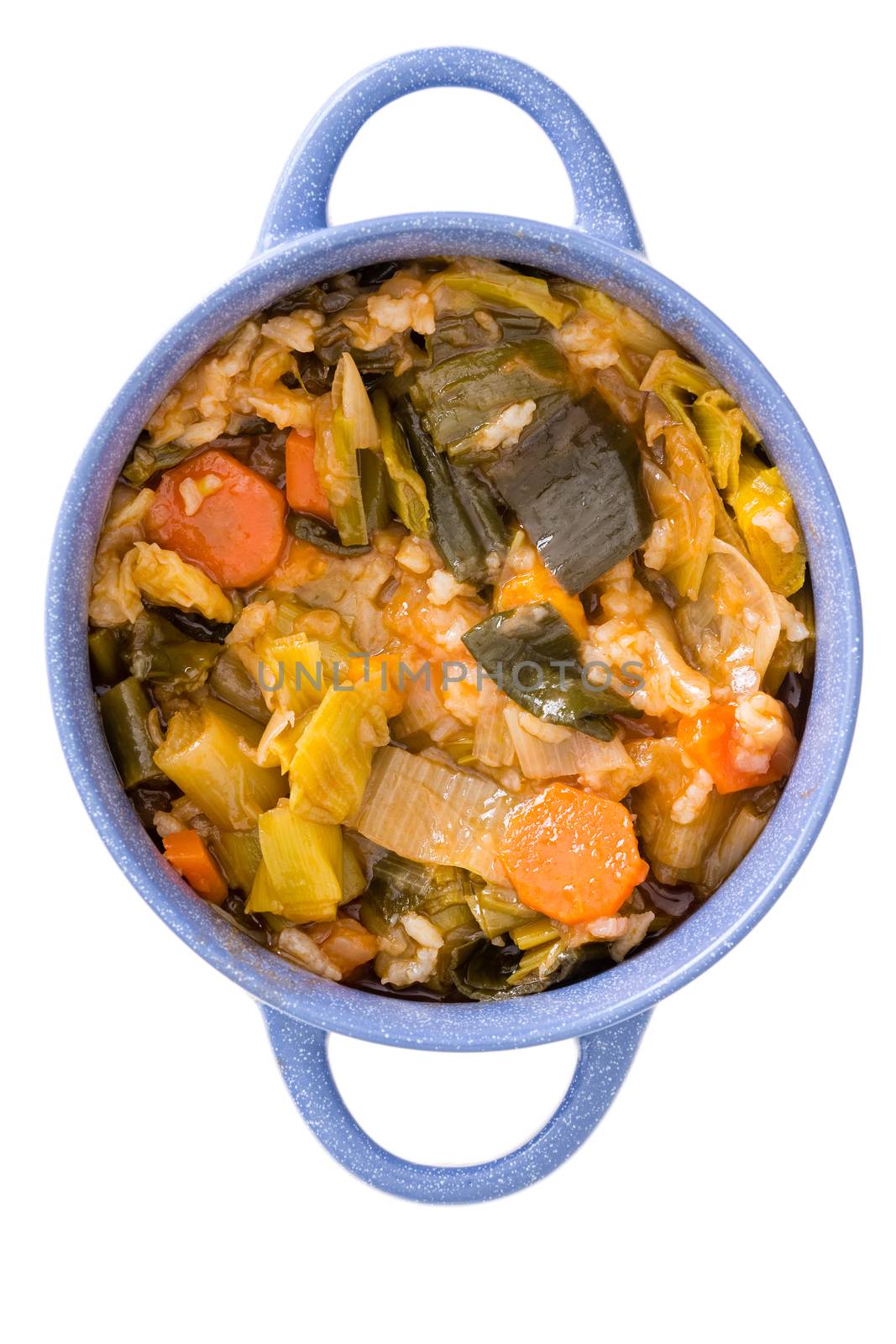 Close up aerial view of a blue ceramic bowl of healthy Turkish leek and carrot casserole isolated on a white background