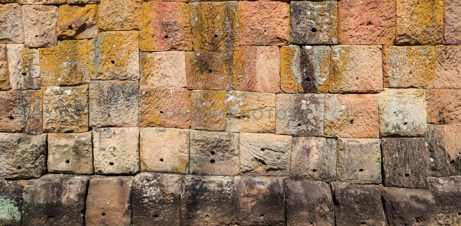 Ancient old and dirty big brick wall inside public temple in Thailand