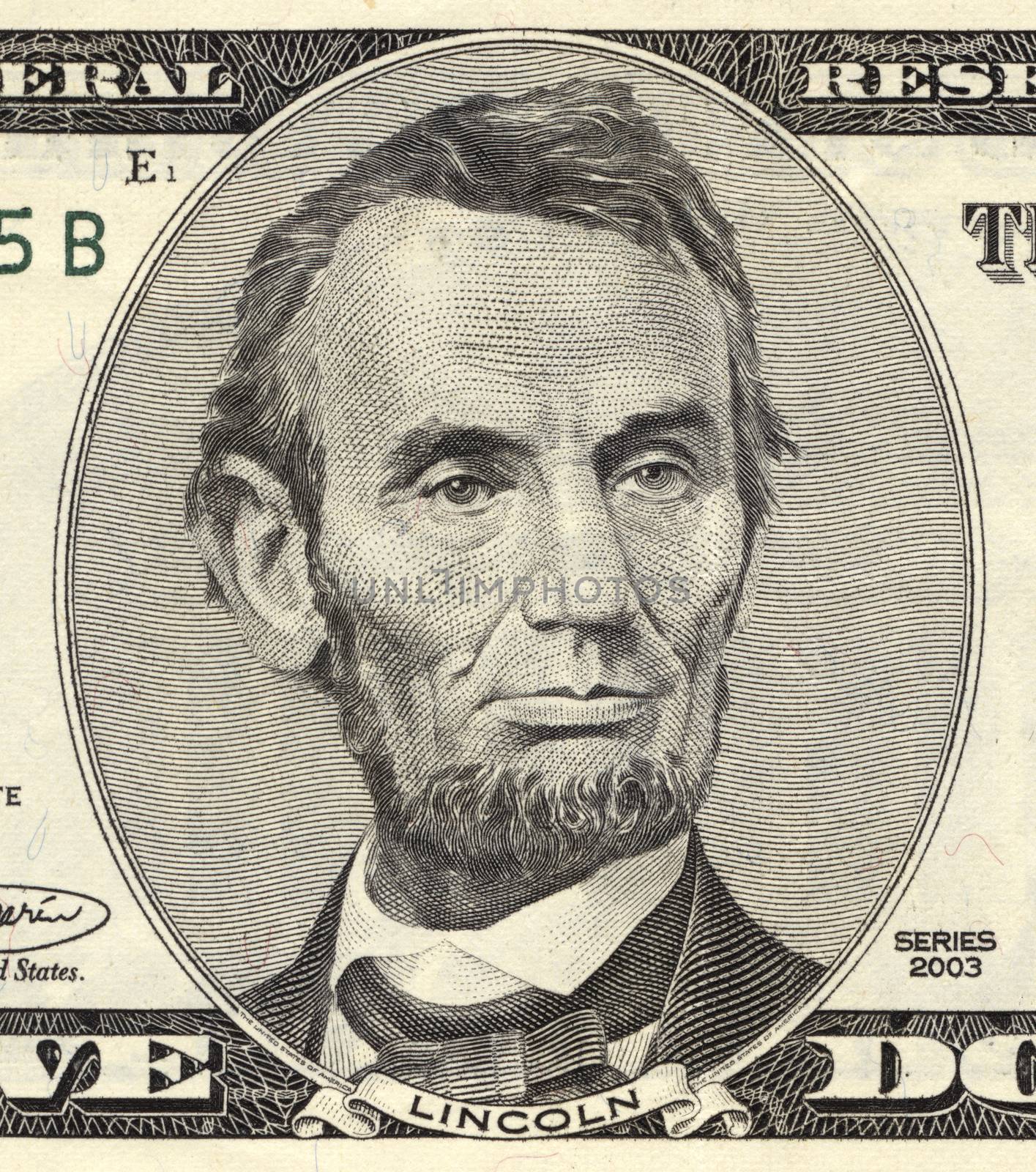 Abraham Lincoln portrait on five-dollar bill, closeup. True colours
