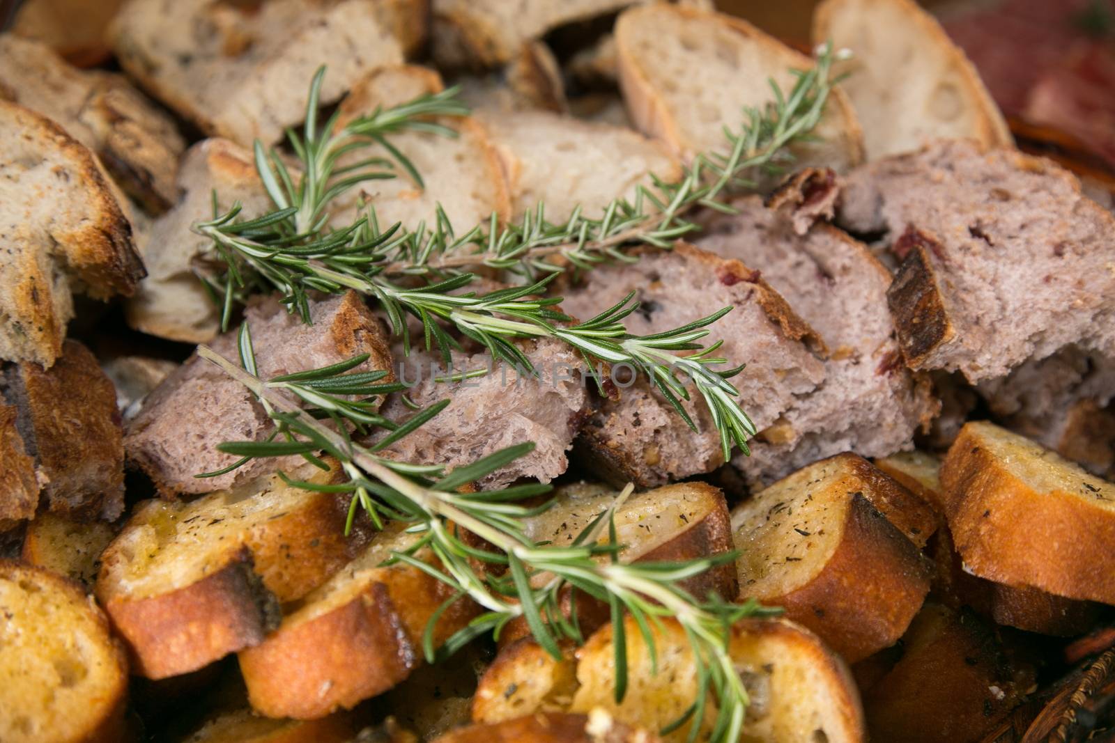 Variety of Sliced Bread with Rosemary Herb by fouroaks