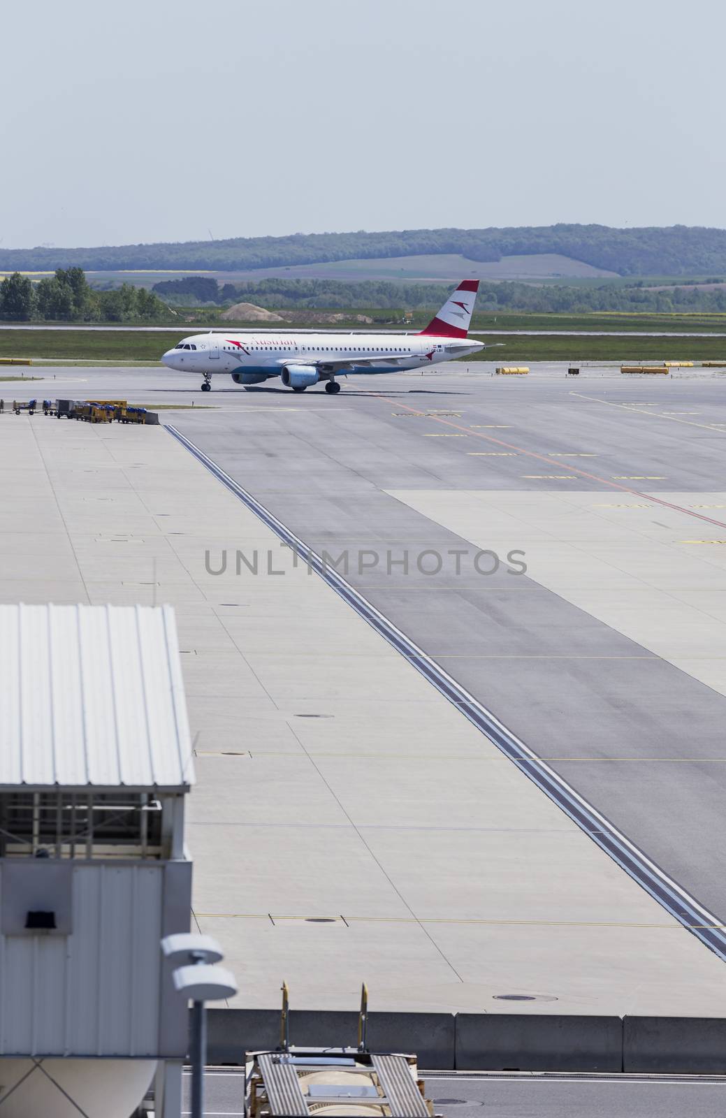 VIENNA, AUSTRIA – APRIL 30th 2016: Plane moving to take off area at Vienna International Airport on a busy Saturday.