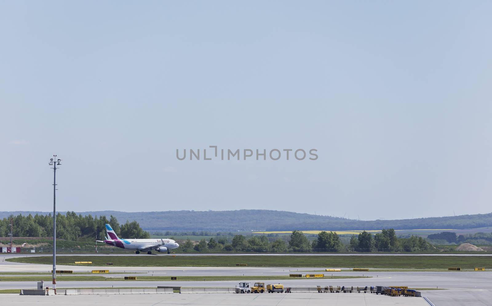 VIENNA, AUSTRIA – APRIL 30th 2016: Plane leaving for taking off on a busy Saturday at Vienna International Airport.