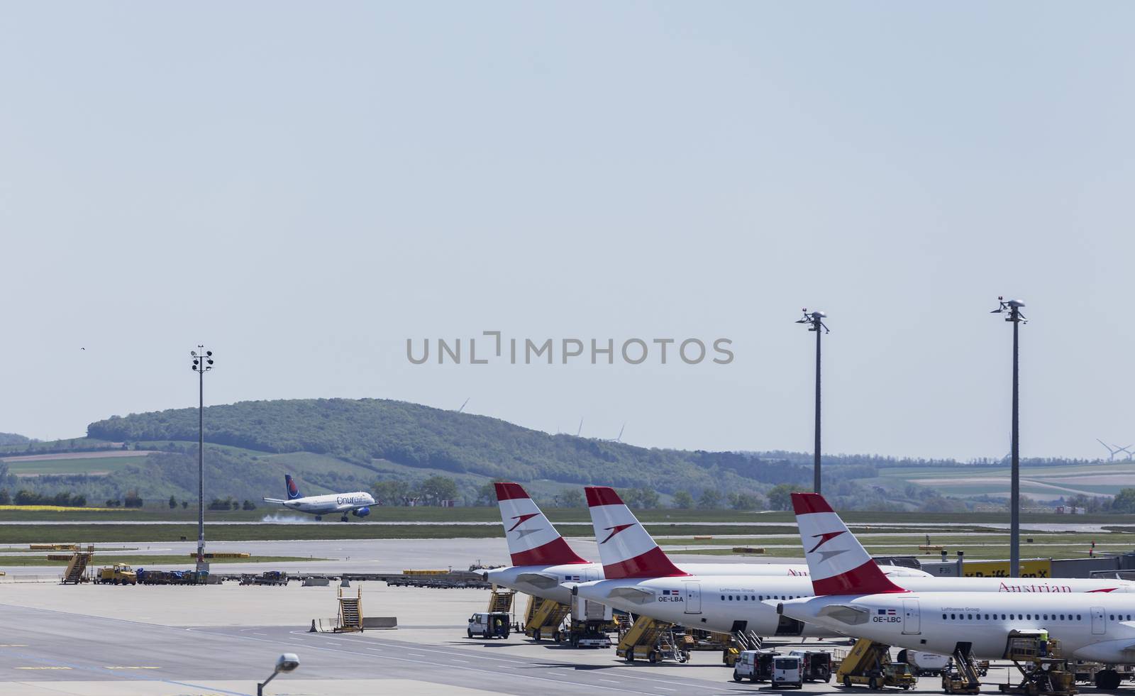 VIENNA, AUSTRIA – APRIL 30th 2016: Austrian Airline planes lined up a busy Saturday at Vienna International Airport.