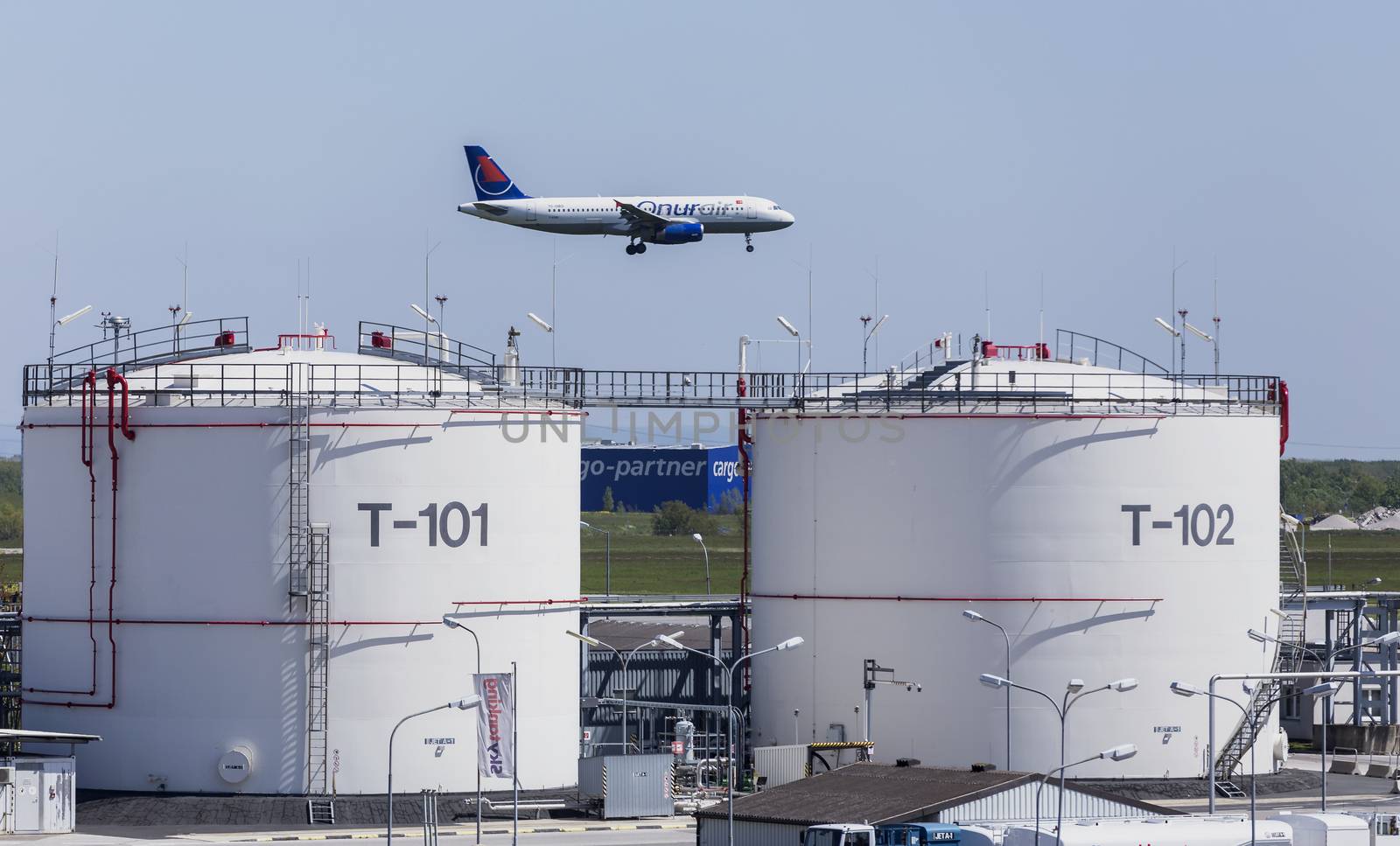 VIENNA, AUSTRIA – APRIL 30th 2016: Plane landing on a busy Saturday at Vienna International Airport.