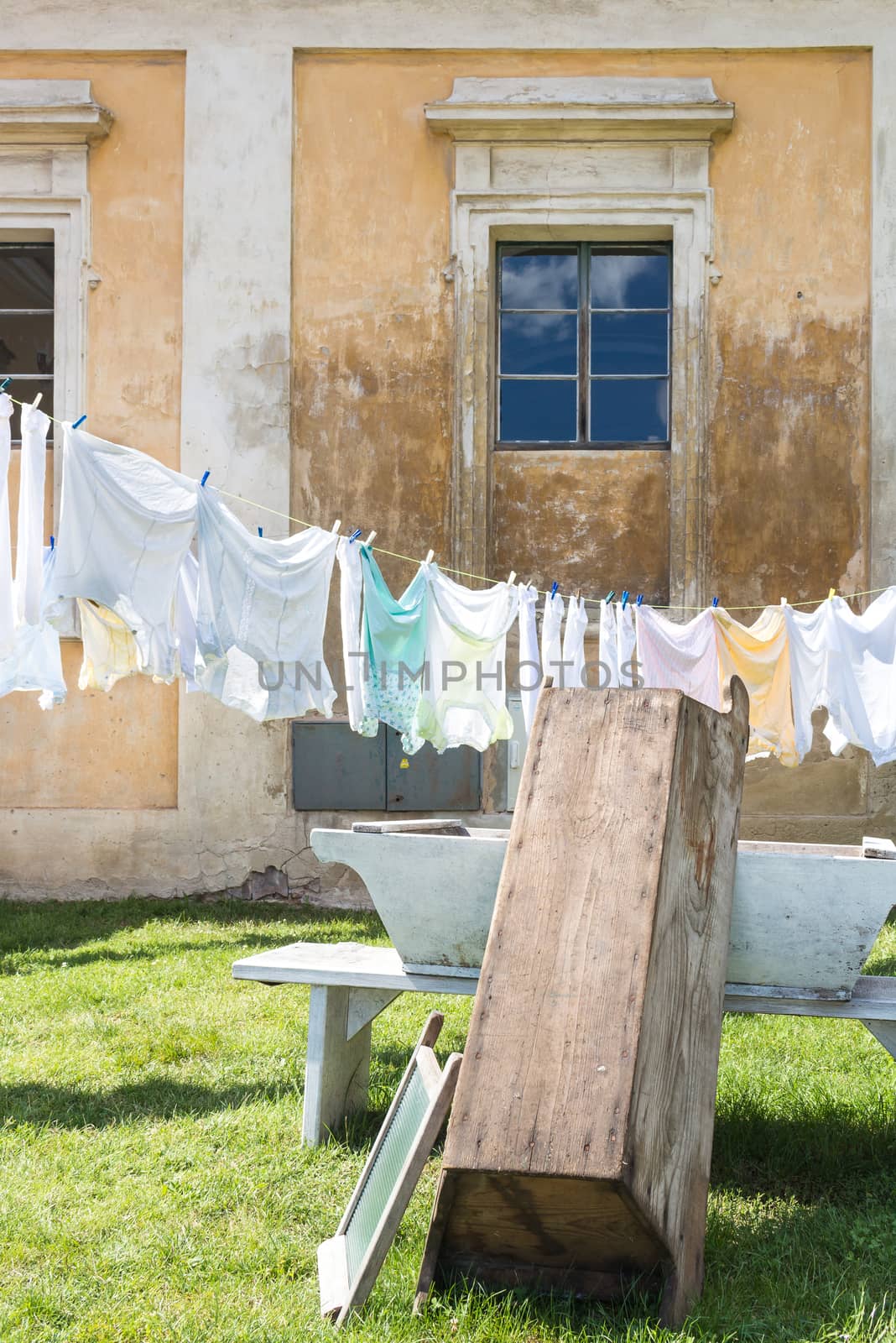 Decoration in the garden of manor-house Milotice in Czech republic. Traditional way of cleaning the laundry and drying it on the fresh air in the sunshine.