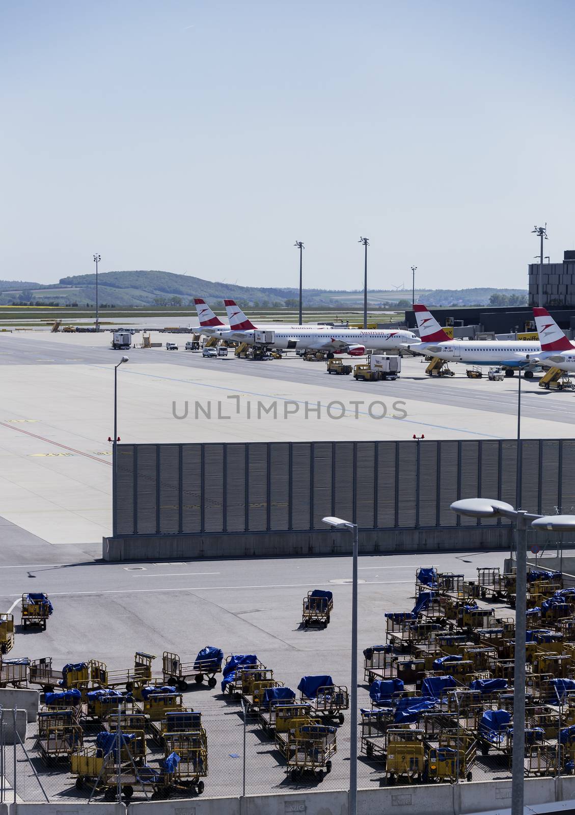VIENNA, AUSTRIA – APRIL 30th 2016: Austrian Airline planes lined up a busy Saturday at Vienna International Airport.
