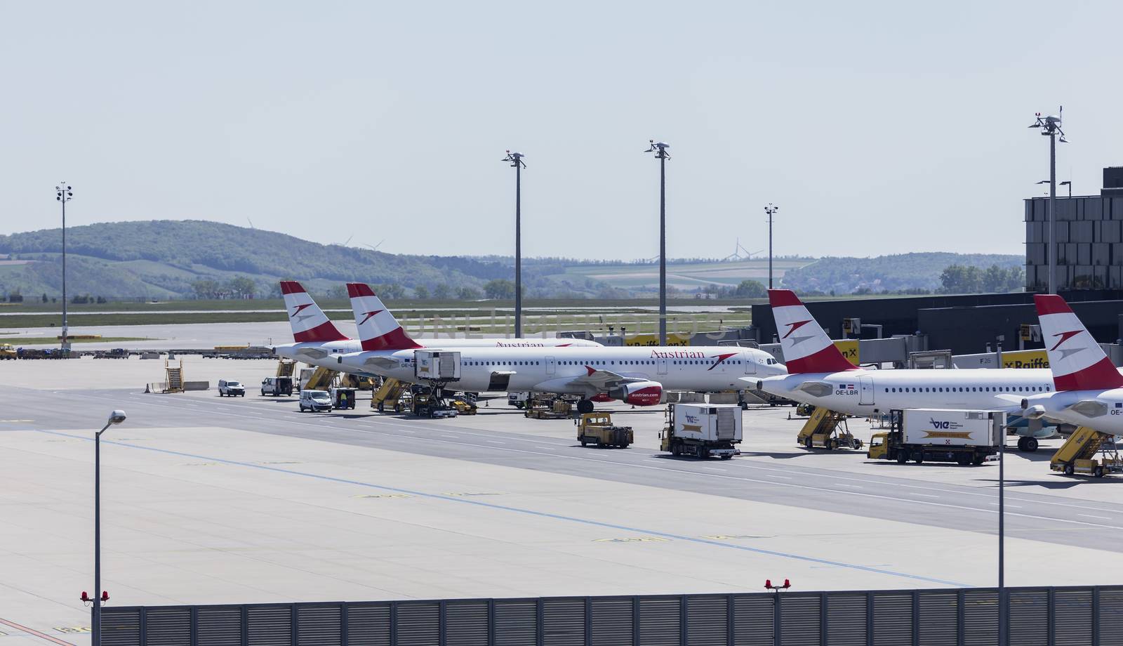 VIENNA, AUSTRIA – APRIL 30th 2016: Austrian Airline planes lined up a busy Saturday at Vienna International Airport.