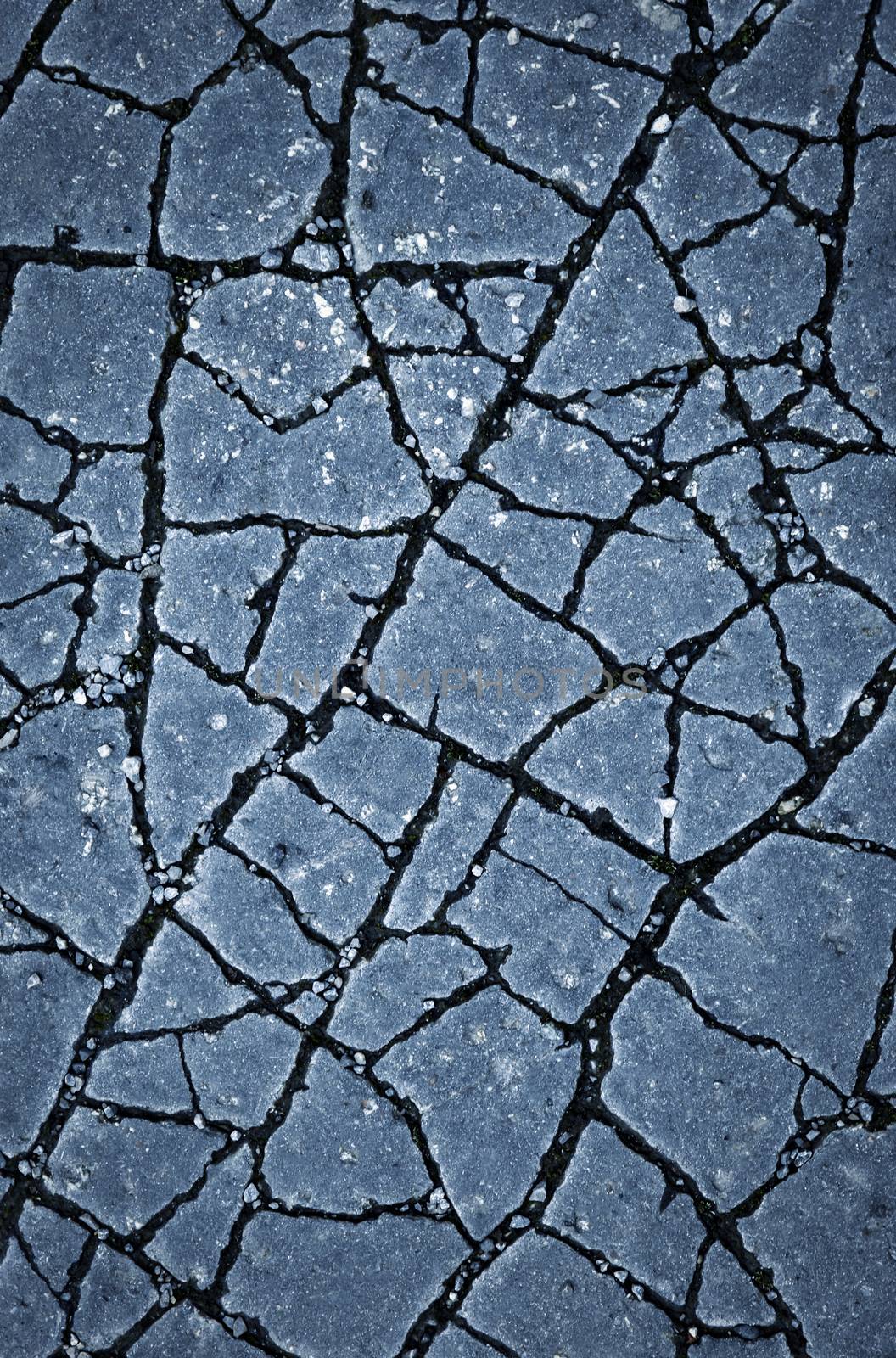 abstract background or texture cracked asphalt pavement surface