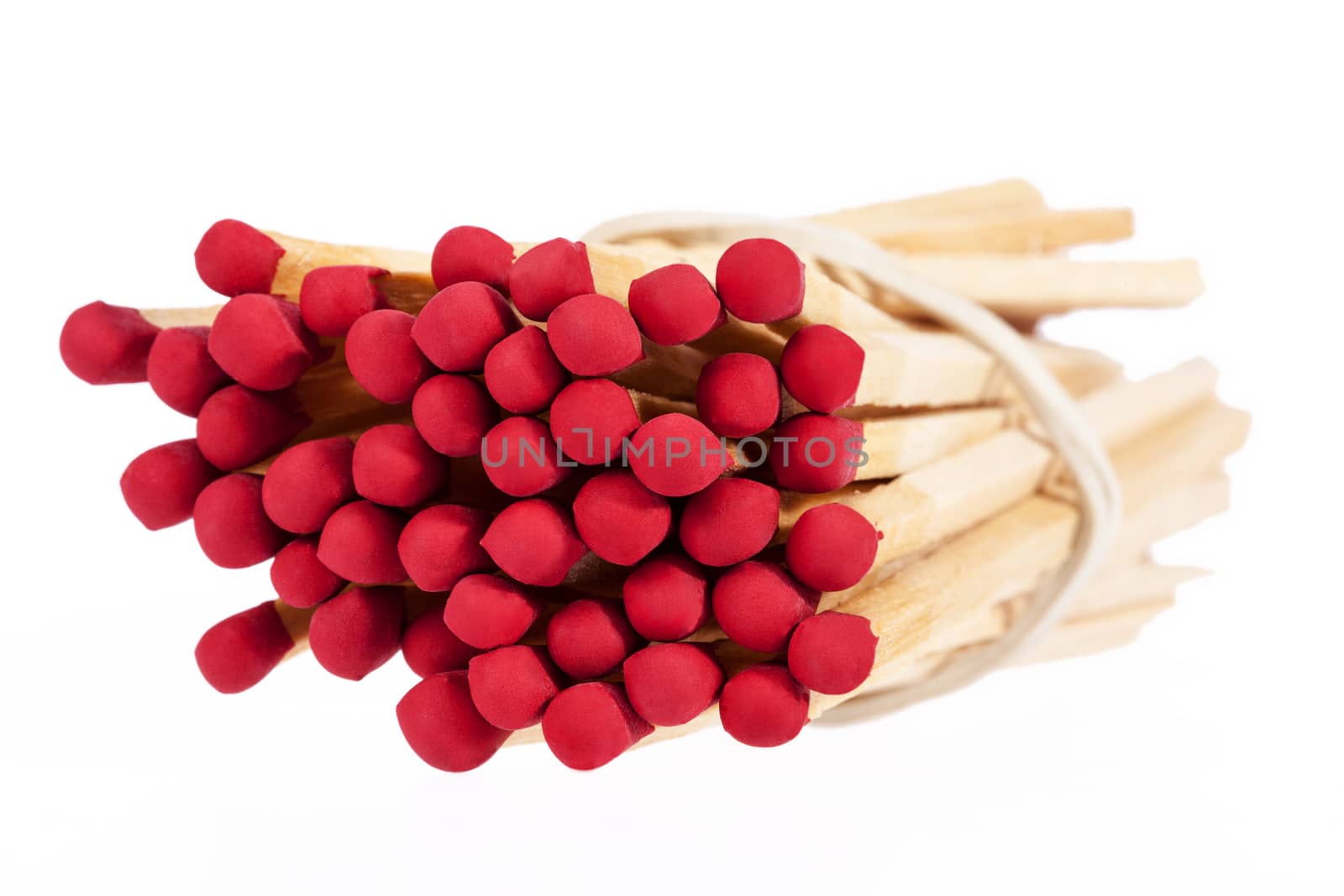 Heap of matches with rad heads isolated on white background, close up
