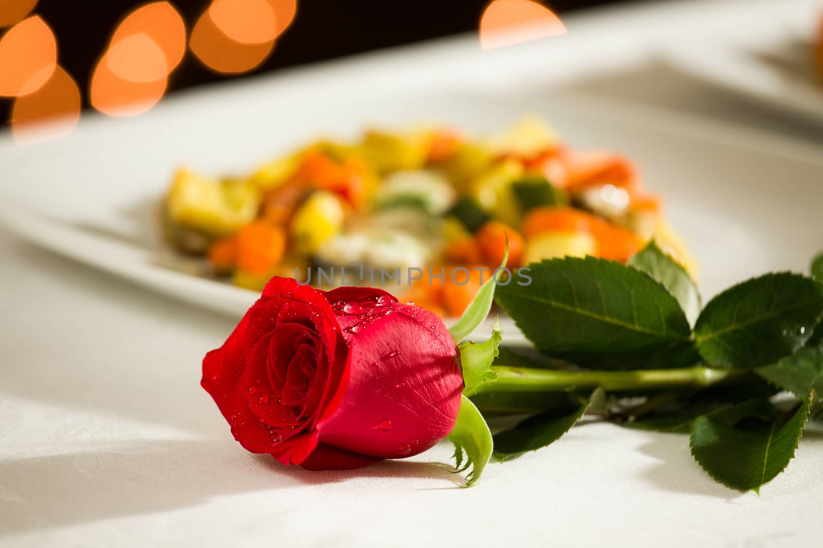 Red rose for a romantic dinner at the restaurant