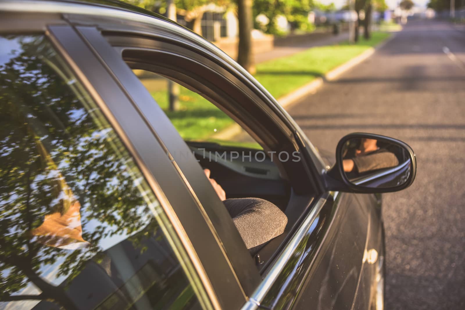 A woman driving a modern car.