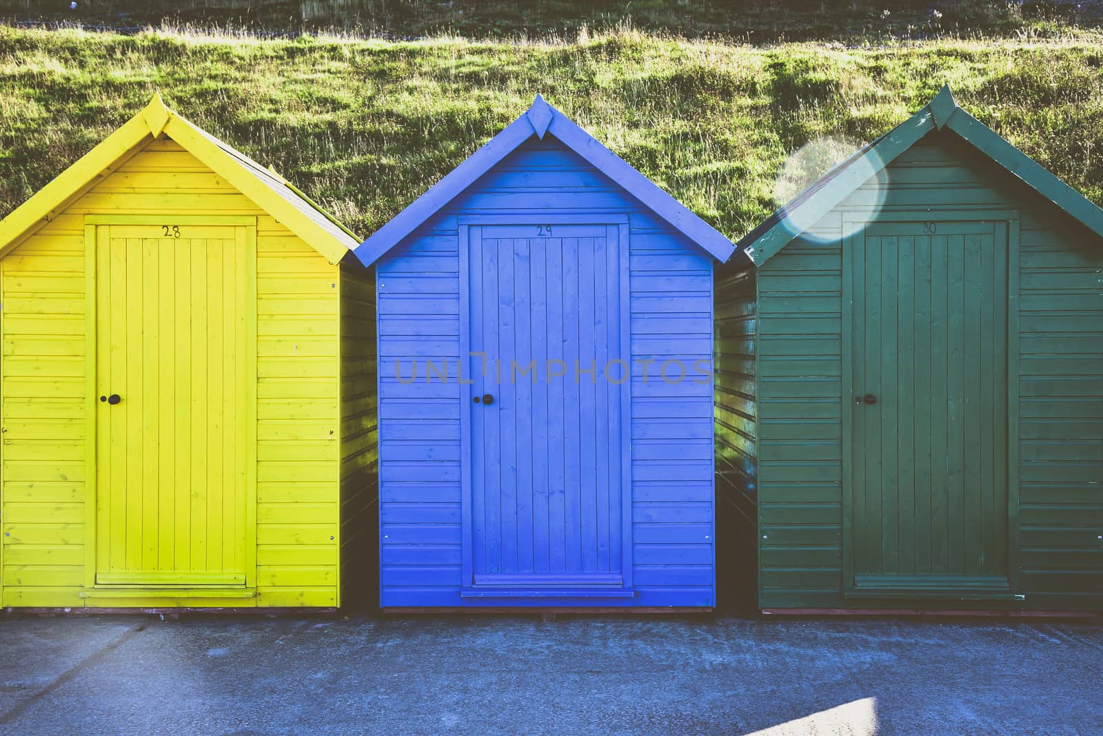 Colourful beach huts at the Whitby Beach with used matt color effect, England
