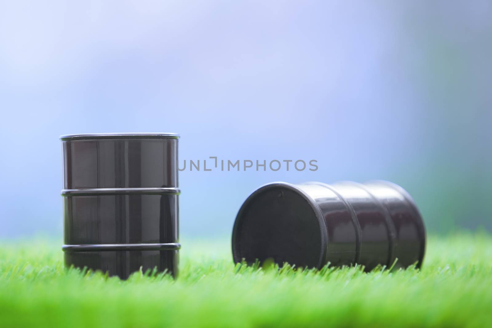 Two oil barrels in the grassland. Horizontal photo