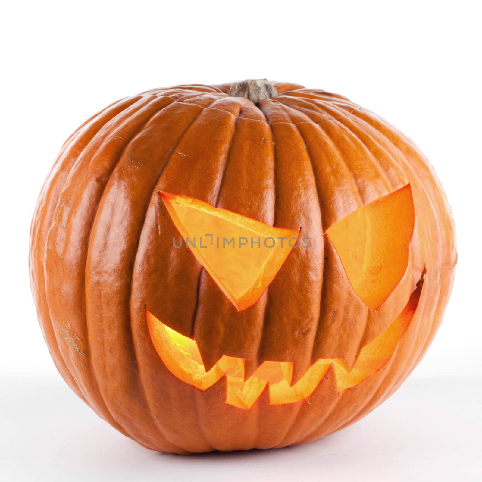 Glowing Halloween pumpkin isolated on white background