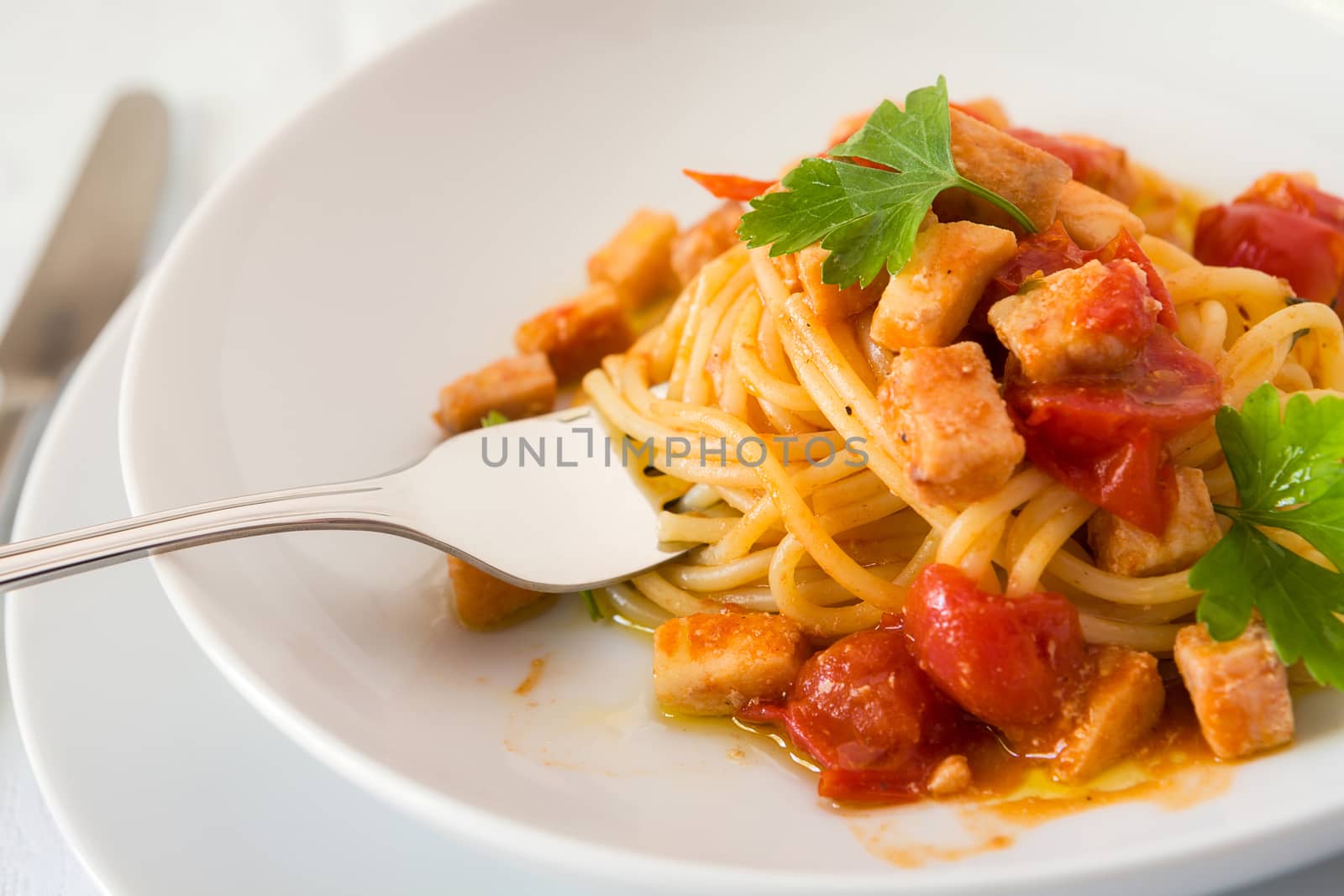 Closeup of spaghetti with fish and little tomatoes by LuigiMorbidelli