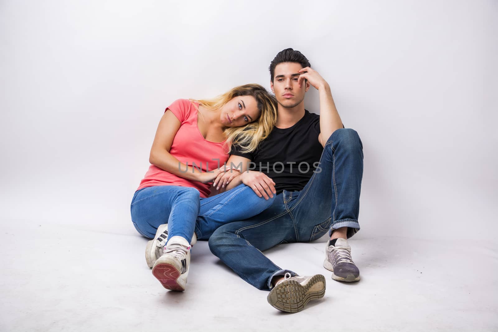 Young couple in love, studio shot by artofphoto
