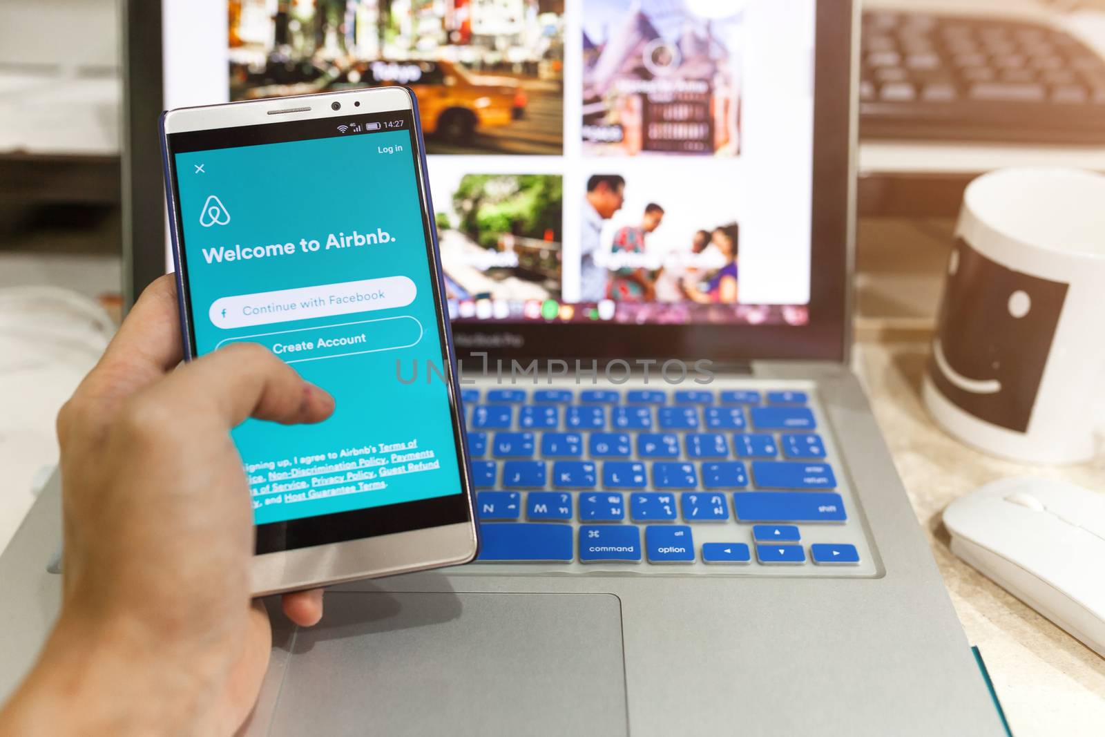 Android device Showing Airbnb application on the screen by nopparats