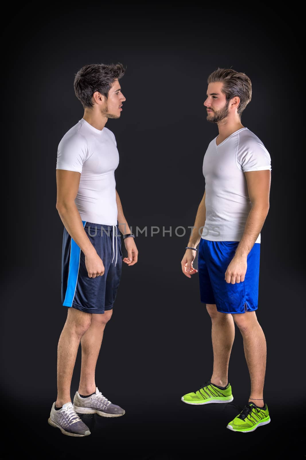 Two young good looking man wearing sportswear by artofphoto