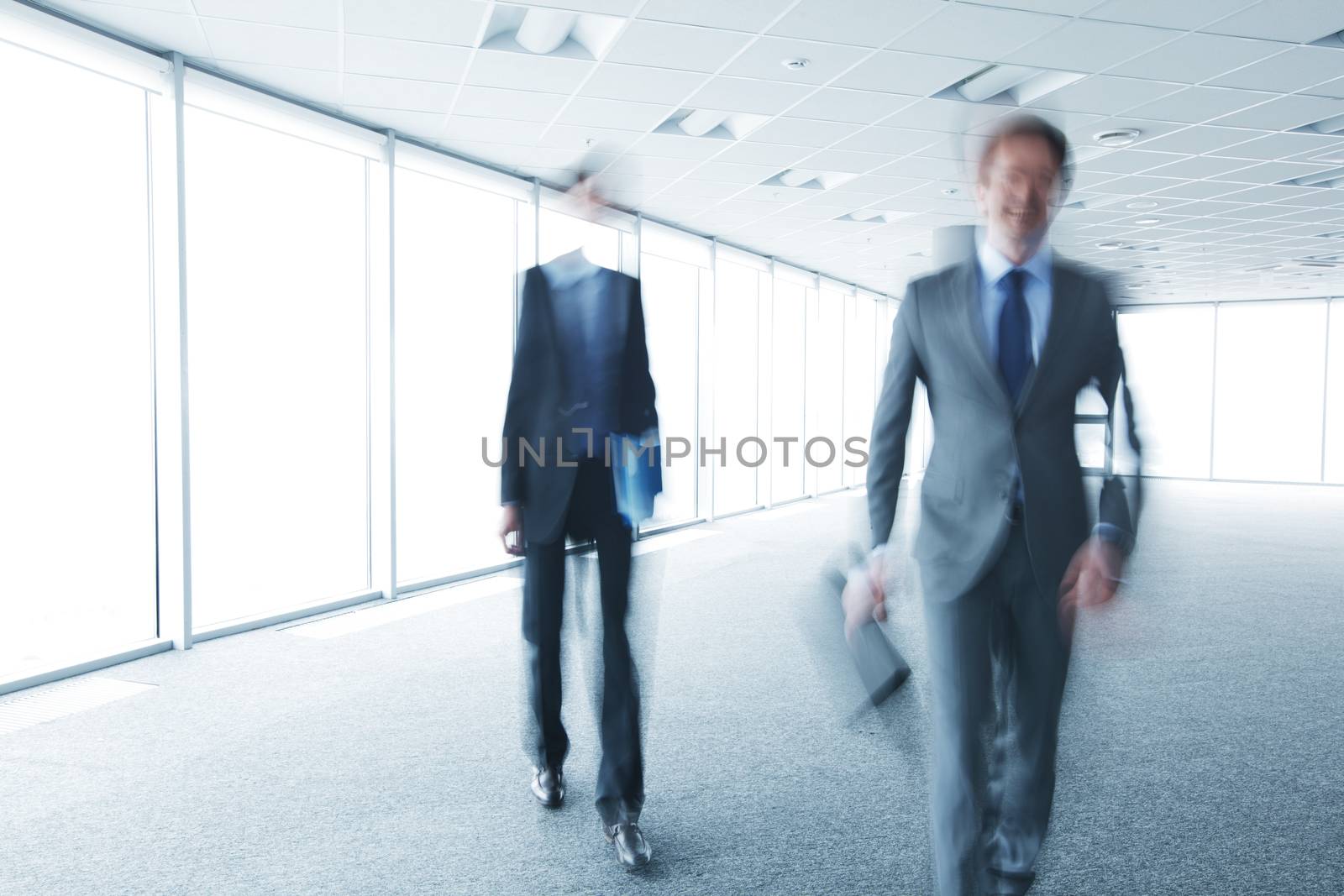 Blurry portrait of walking businessman by ALotOfPeople
