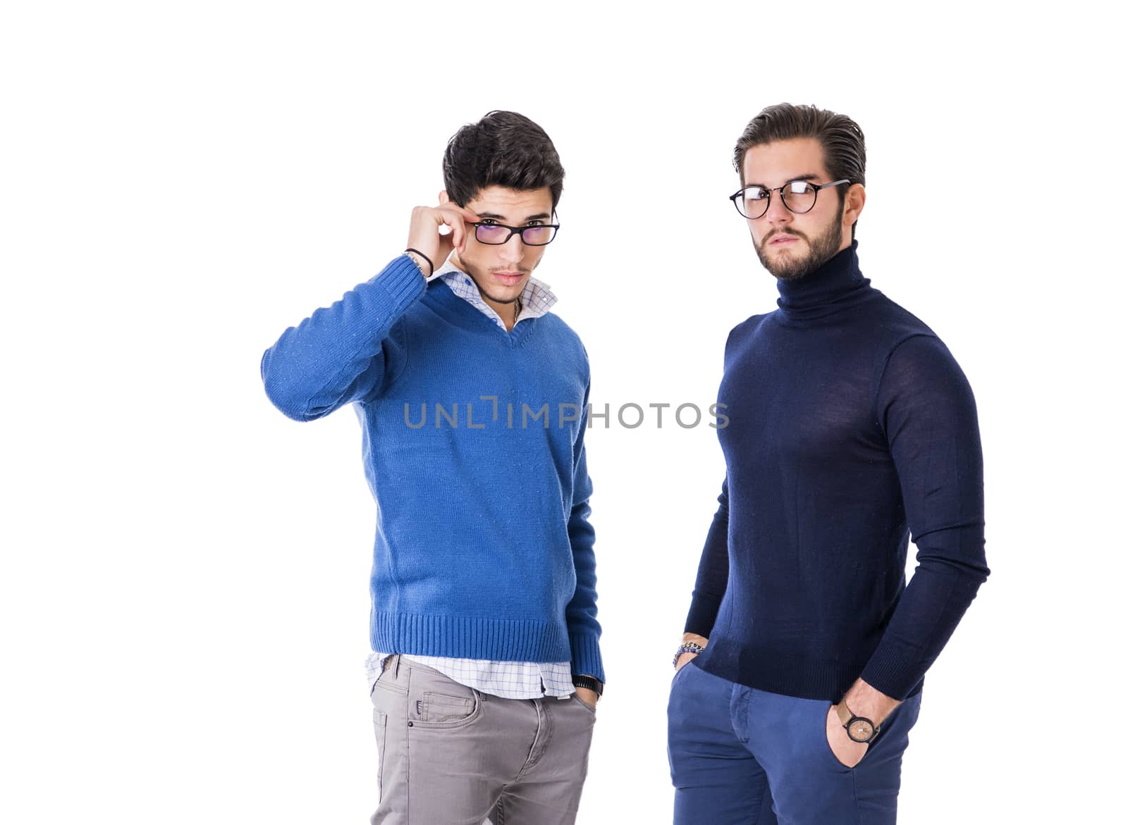 Two good-looking men in stylish clothes.Studio shot.