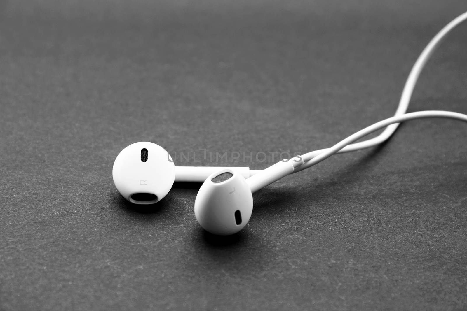 Headphones of white color isolated on black